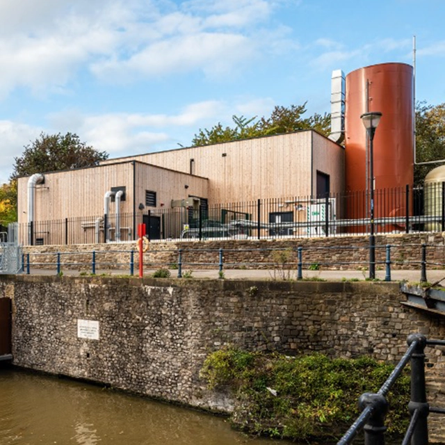 Castle Park Energy Centre building alongside river.