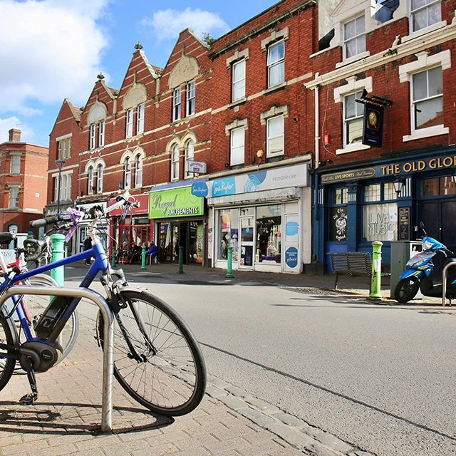 East Street Bedminster shops with bicycle stand and bike.