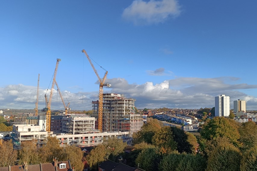 Skyline showing Bedminster Green development, cranes, terrace houses and trees.