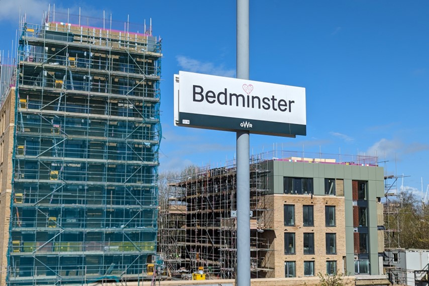 Student accommodation block under construction with Bedminster station sign in foreground.